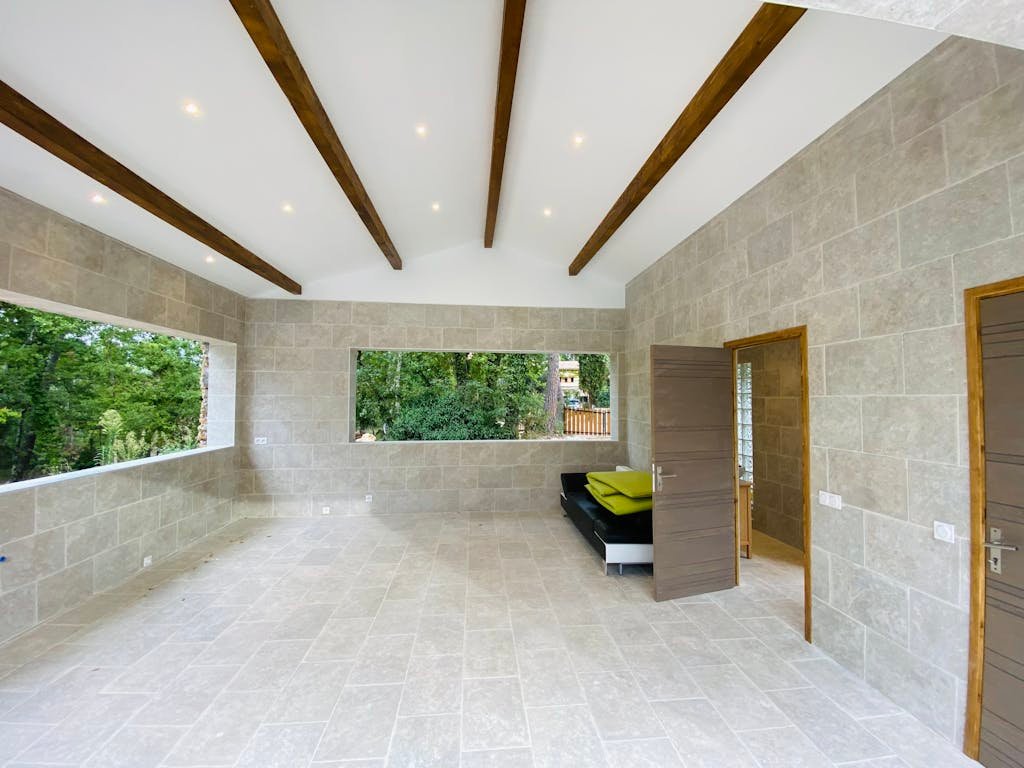 Bright and airy interior space with modern design and large windows.